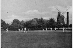 Tower Mill with sails and chimney from cricket field