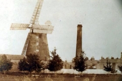 Tower Mill with sails and chimney from sports field