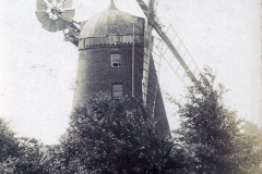 Tower Mill with sails from sports field